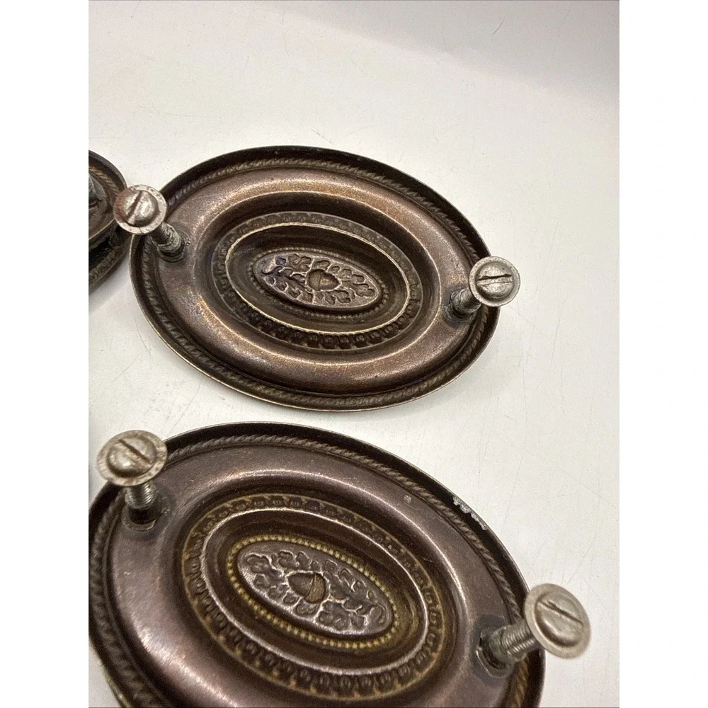Antique Hepplewhite-style drawer pulls embossed oval backplate